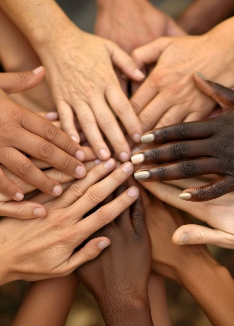 A close-up of diverse hands coming together, symbolizing the No.624 community and connection.